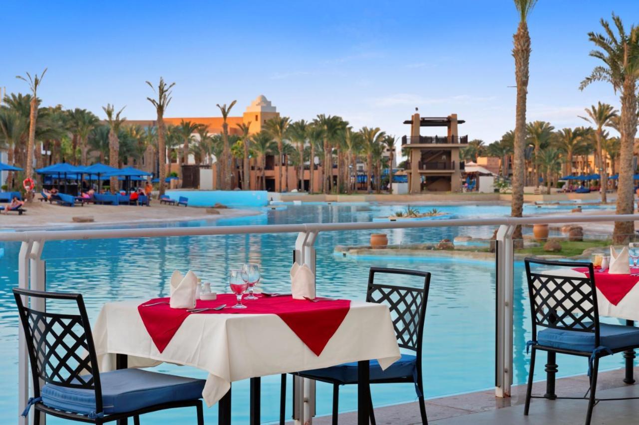 Pickalbatros The Palace Port Ghalib Exterior photo View of the pool at the Hilton Luxor